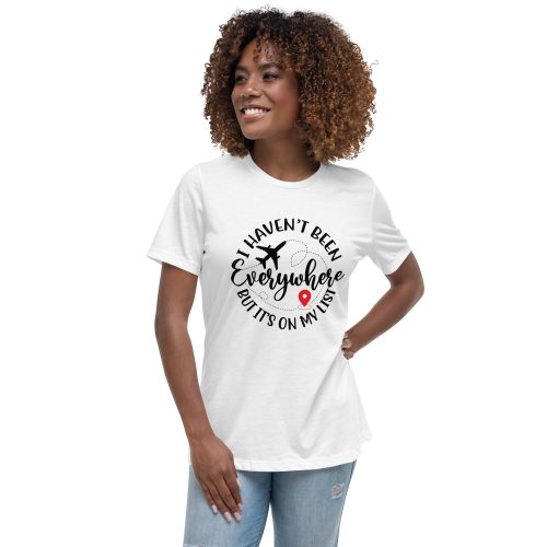 Woman wearing travel-themed shirt with airplane graphic.
