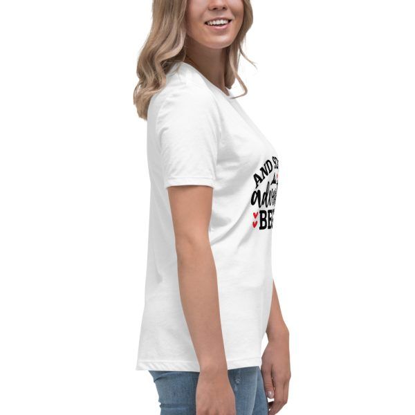Woman wearing white printed T-shirt, side view